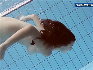amateur Lastova proceeds her swim